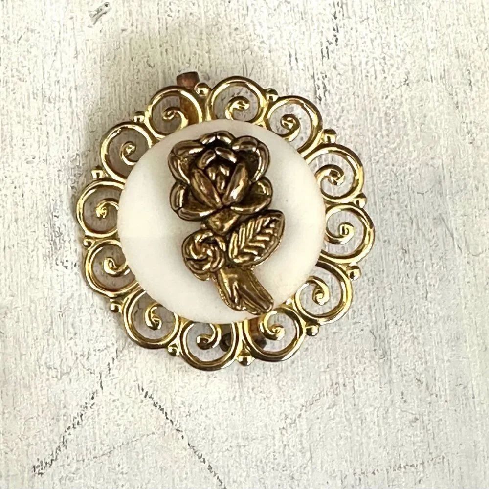 Gold tone flower pin
